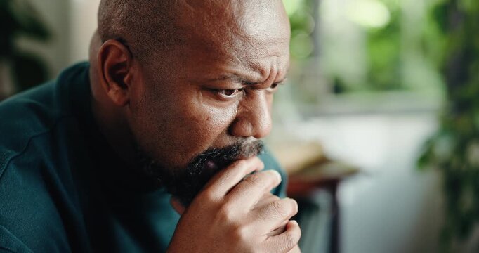 Home, thinking and black man concerned with reflection, retirement and sad with mental health. Mature person, pensioner and regret with nostalgia, memory and doubt with daydreaming in house lounge