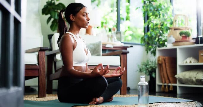Woman, meditation and yoga for fitness in home with mindfulness, spiritual healing and zen. Female person, lotus pose and yogi with holistic balance, inner peace and mental health for self care goals - Powered by Adobe