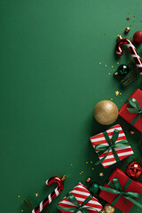 Festive vertical scene features wrapped gift boxes, candy cane, ornaments, and gold accents...