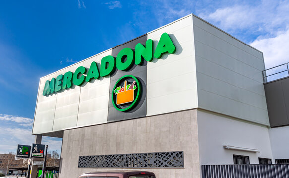 Seville, Spain; February 15, 2025: Exterior view of a Mercadona supermarket with store logo sign on facade.