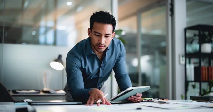 Happy man, tablet and writing with notes at office, documents or project report at investment company. Person, broker and advisor with tech, feedback and stats with fintech app at financial agency