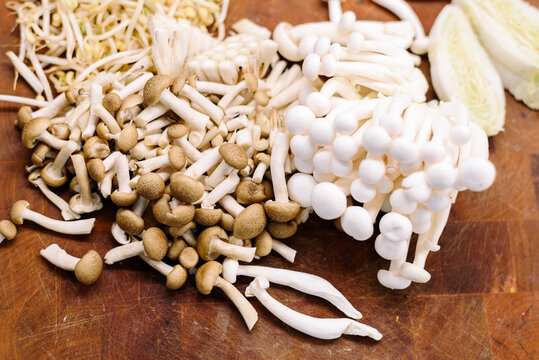 Fresh setas shimeji mushrooms on kitchen counter with copy space for text