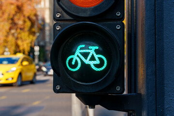 bicycle traffic lights and view of city street and road traffic, city life in Budapest, Hungary