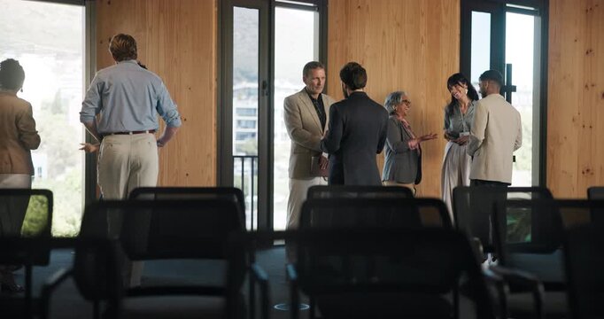 Business people, discussion and handshake in seminar, networking and collaboration for global trade. Group, talking and shaking hands for foreign investment, agreement and partnership for venture