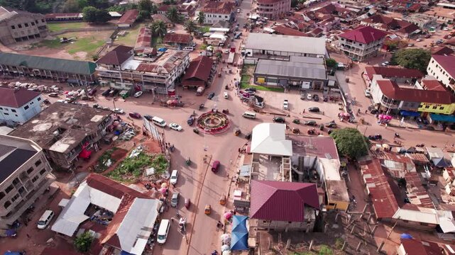 Aerial view of Berekum township roundabout in Ghana, bustling with daily life and vibrant urban activity