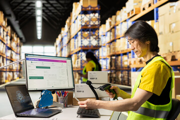 Fulfillment center staff engages in order picking and inventory control, scanning shipping labels in the warehouse. Barcode scanner tool used for express delivery of merchandise.