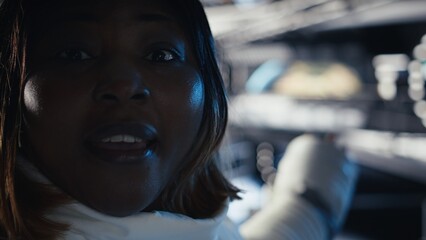 Extreme close up of astronaut exploring planetary surfaces talking with command center during videocall. Cosmonaut gathering stellar data provides scientific findings to Earth team