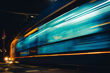 light trails of tram on the street at night