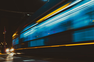 light trails of tram on the street at night