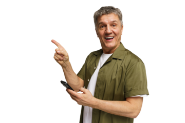 Man smiles and points while holding a phone