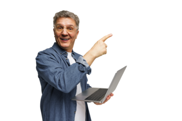 Man points while holding laptop and smiling