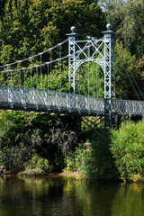 Detail of tower on suspension bridge across river in summer