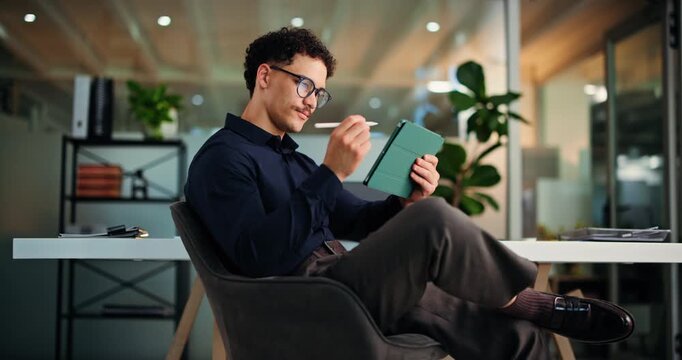 Night, stylus or man with tablet in office, proofreading story or fact check for publication homepage. Writing notes, review article or editor with digital feedback, tech or overtime for deadline