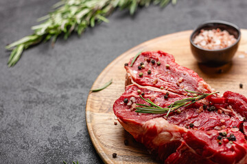 Raw beef meat on a wooden tray