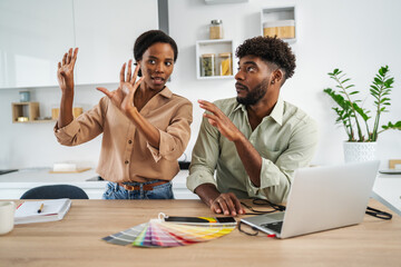 Couple having an argument while discussing home renovation