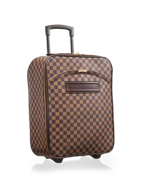 Louis Vuitton trolley, Pegase 45 trolley suitcase model, in Damier canvas with leather details, photographed on a white background with reflection. Milan, Italy, October 3, 2025.