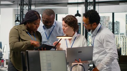 Portrait of smiling engineering team in office automating workflows using artificial intelligence tech. Happy coworkers refining deep learning computational models for faster processing, camera B - Powered by Adobe