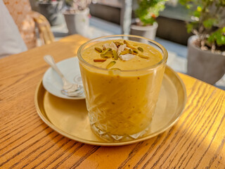 Stylish chilled iced latte served at a Dubai beachfront cafe, modern coffee scene. Modern Dubai beach restaurant