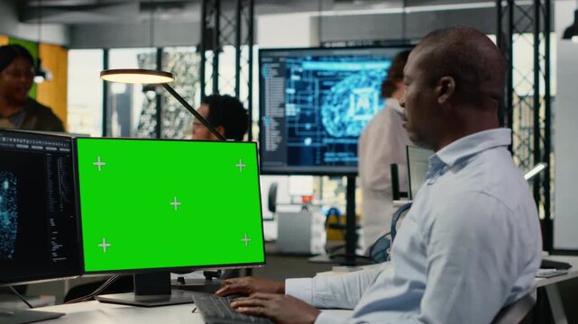Isolated screen computer used by admin in office doing AI software development to launch new features. Chroma key PC used by worker in startup company writing artificial intelligence program, camera B