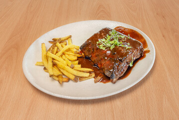 Dry Memphis-style pork ribs, without sauce but with a generous coating of spice rub including smoked paprika, garlic, and cumin