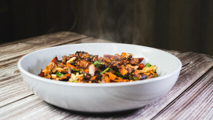 Smoking hot shredded lamb served in a bowl with mixed vegetables, ready to eat. Tender, juicy, and perfectly seasoned. Ideal for Middle Eastern rice dishes, wraps, or a hearty stand-alone meal.