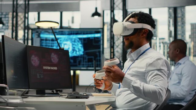 Programmer in office using virtual reality tech to fix hacking attempt on corporate network. IT expert uses VR headset to investigate unauthorized access alerts, working to mitigate damages, camera B