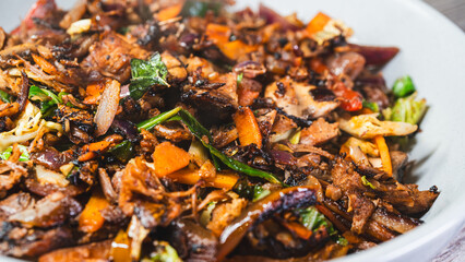 Smoking hot shredded lamb served in a bowl with mixed vegetables, ready to eat. Tender, juicy, and perfectly seasoned. Ideal for Middle Eastern rice dishes, wraps, or a hearty stand-alone meal.