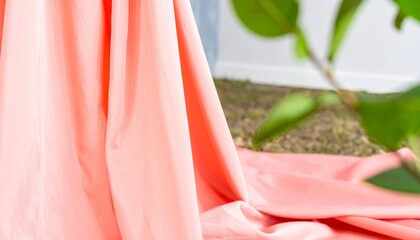 Coral fabric with closeup, outdoors, and natural light.