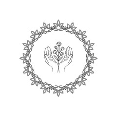 Hands gently holding a delicate plant with a small flower, symbolizing care and growth.