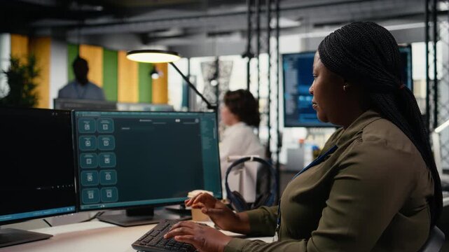 Programmer solving tasks with AI LLM chatbot answering prompts using predictive technology. Startup company worker using computer to interact with large language model program, camera A