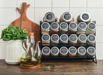 Assorted spices in glass jars with metal lids