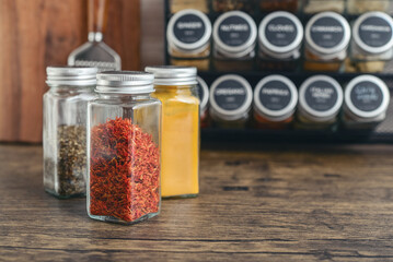 Saffron, turmeric and oregano in glass jars