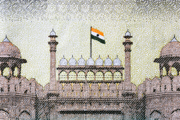 Indian 500 rupees bank note extreme close up view of Red Fort image with Indian flag on the bank...