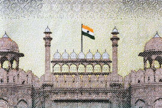 Indian 500 rupees bank note extreme close up view of Red Fort image with Indian flag on the bank note.