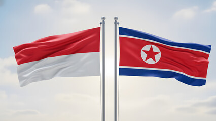 Flags of Indonesia and North Korea waving side by side against a bright sky, symbolizing diplomatic relations.