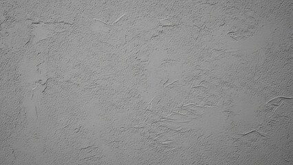 Fototapeta premium Close-up photographic view of a raw, expansive, subtly textured grey stucco wall surface used as a modern architectural background.