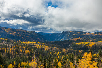 autumn valley in the mountains with dramatic clouds