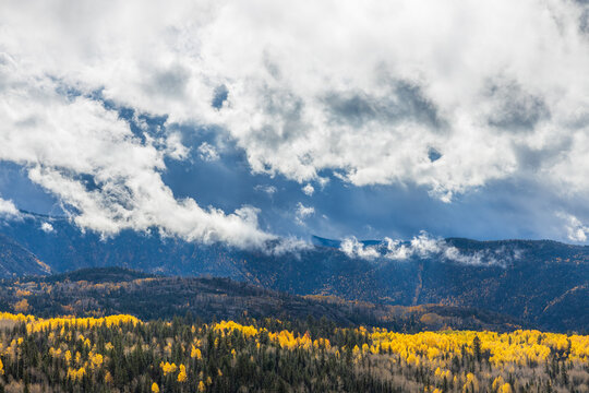 mountain landscape in autumn with low wispy clouds