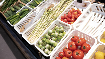 Fresh vegetable market tomato cherry tomato cucumber lemongrass ginger eggplant basket organic healthy colorful produce retail grocery stall farm to table vibrant