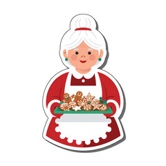 Mrs Claus holding a tray of freshly baked gingerbread cookies.