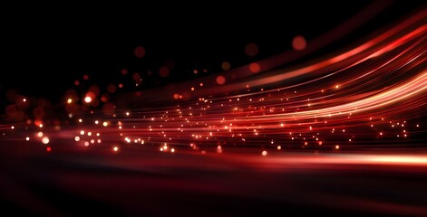 Dynamic abstract streaks of vibrant red light with glowing particles creating a sense of motion and energy against a dark background