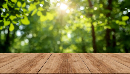 Empty wooden table under sunlit green foliage