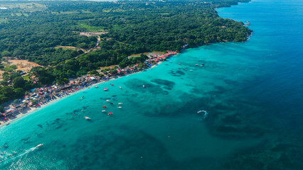 Obraz premium Aerial view of coastal town and boats in Barú, Colombia