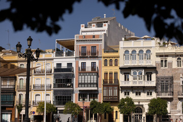 Morning sun shines on colorful buildings in Plaza de San Francisco in the Casco Antiguo...