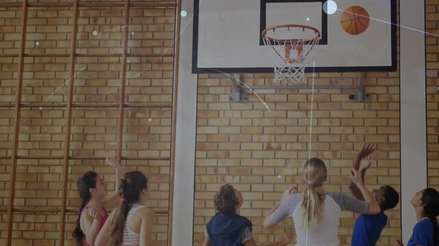 Teen in pink shooting ball at school hoop rebounding right blue scoring overlays appearing training