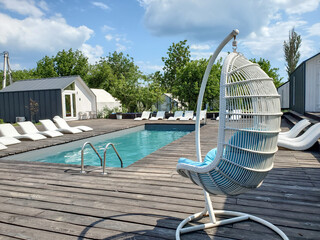 Outdoor recreation in glamping by the pool on a hot summer day, Ukraine, Odessa, 2022.07.23