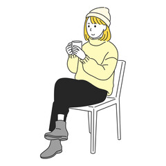 温かい飲み物を飲んでリラックスする女性