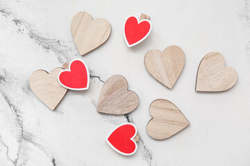 Fototapeta premium Wooden hearts on white grunge background. Valentine's Day celebration