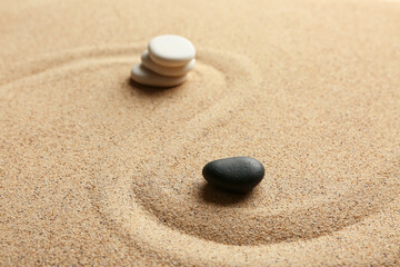 Spa stones on sand with line. Zen concept