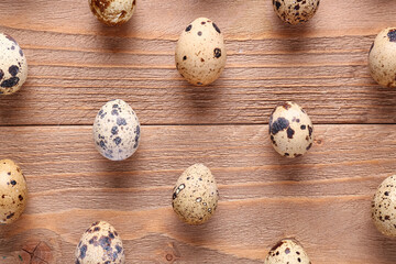 Quail eggs on wooden background